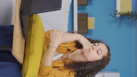 Vertical-video-of-The-young-woman-who-fell-asleep-in-front-of-a-laptop.